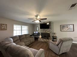 Large living room, open to kitchen, ready for game day.