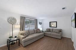 Bright living room with two plush sofas and plenty of space to unwind