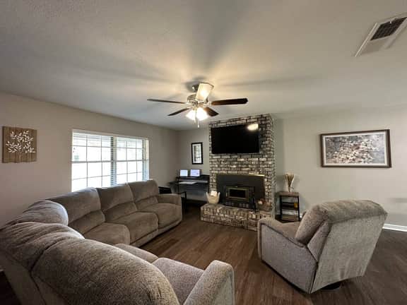 Large living room, open to kitchen, ready for game day.