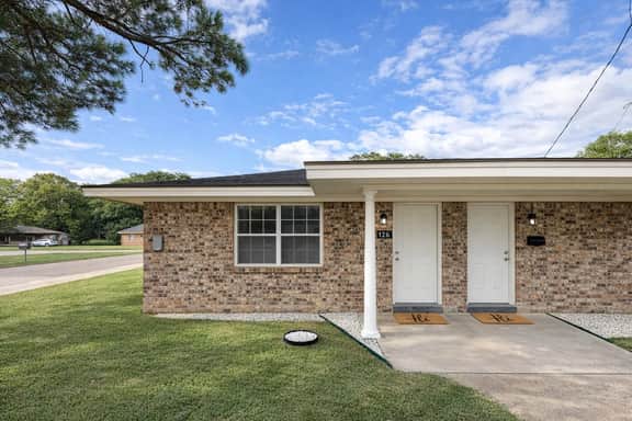 Charming brick duplex with private entry and welcoming curb appeal