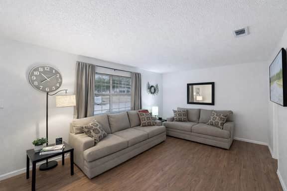 Bright living room with two plush sofas and plenty of space to unwind